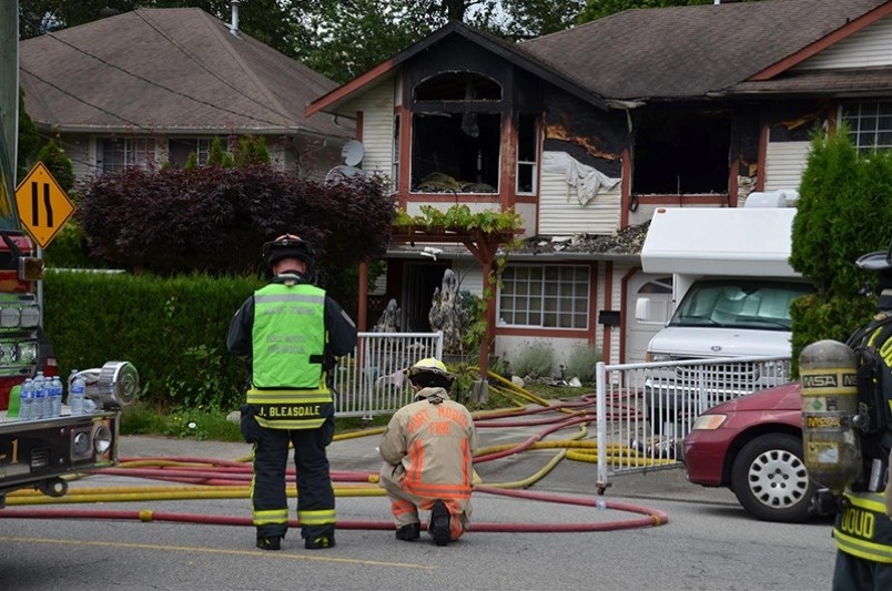 Firefighters on the scene of a Port Moody home burned out in a 2016. The father of the house was lat