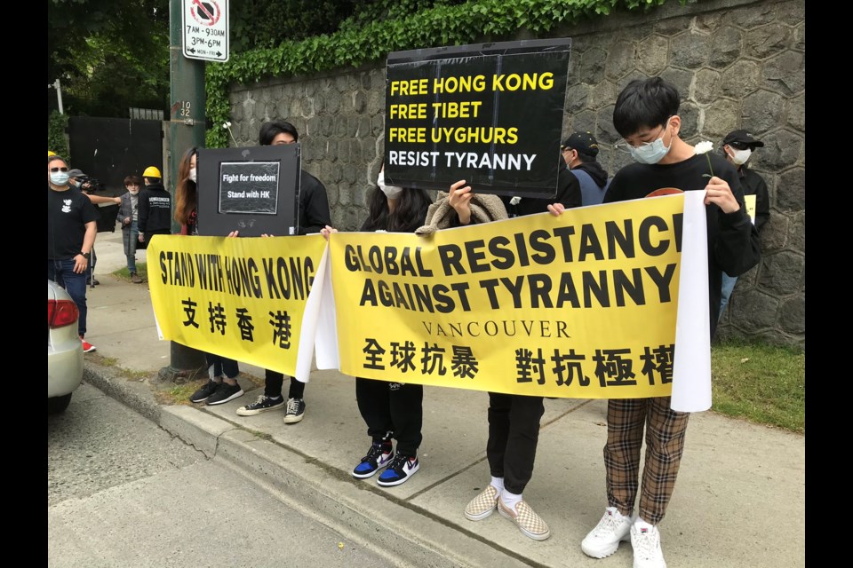 Pro-democracy activists for Hong Kong picketed the Chinese consulate in Vancouver on Granville Street on Saturday May 23, 2020 to voice opposition against a national security law proposed to be implemented unilaterally by Beijing's National People's Congress. There were an estimated 100-200 people along Granville Street. Photo by Ivy Li