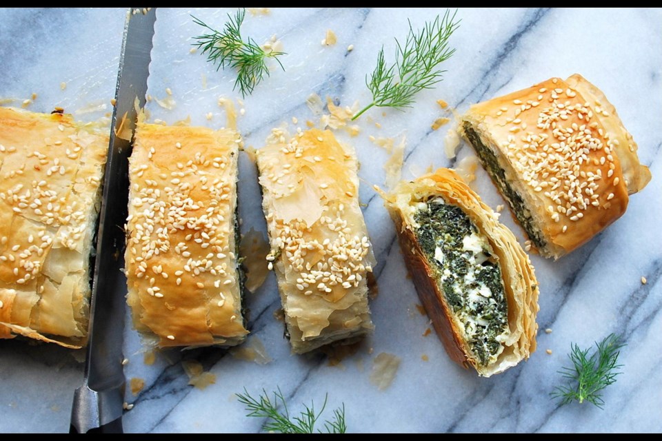 This savoury strudel sees flaky phyllo filled and baked with a rich spinach and cheese mixture.