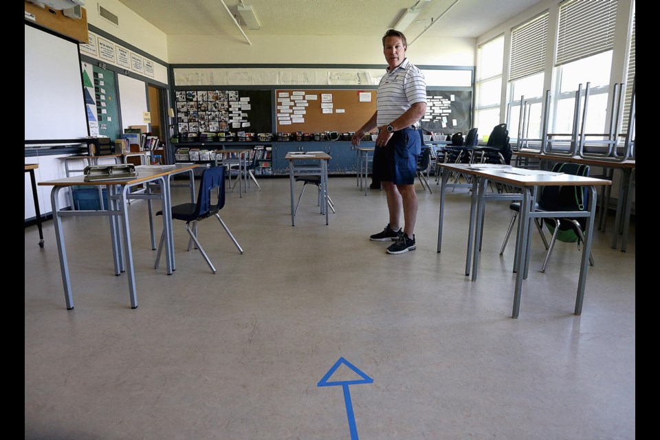 Sean Powell, principal of Lansdowne Middle School in Saanich, shows off the preparations made in advance of the June 1 return to school. B.C. students will go back to class full time on Sept. 10.