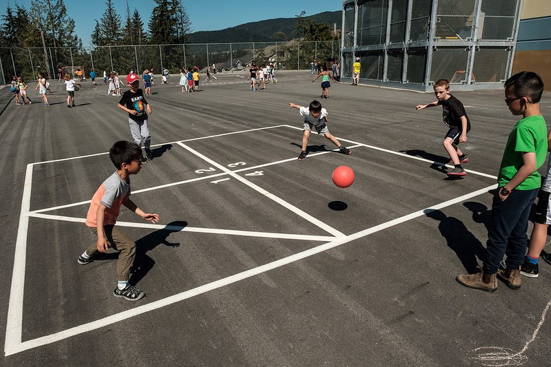 Students play in a courtyard at Coquitlam's Smiling Creek Elementary. With the global COVID-19 pande