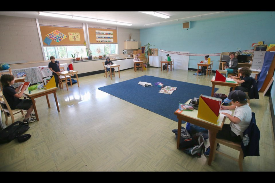 Students work in Lesley Guthrie's 1-3 Lower Elementary class at Maria Montessori school.