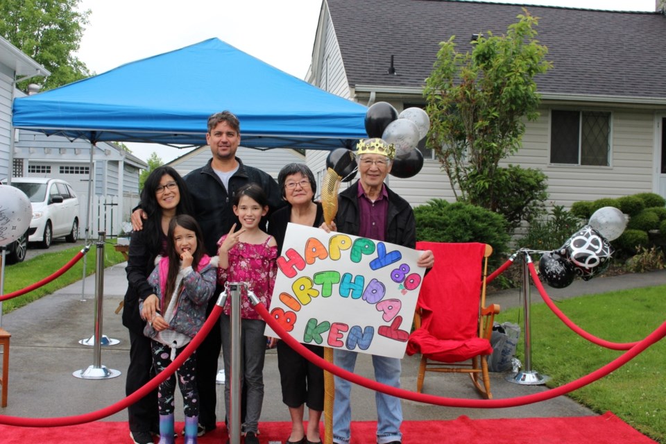 Ken Yoshihara's friends and family marked his 80th birthday with a drive-by parade due to COVID-19. From right to left: Ken Yoshihara and wife Hiroko, granddaughter Ava, son-in-law Kevin Schindel, daughter Karen and granddaughter Kaida.