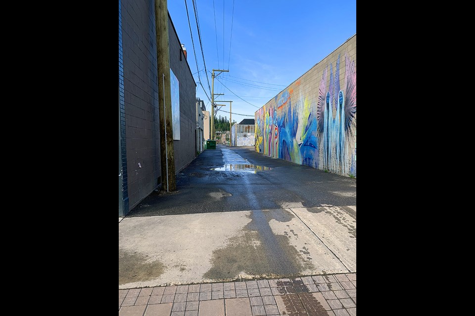 A recently flushed alleyway in downtown Prince George.