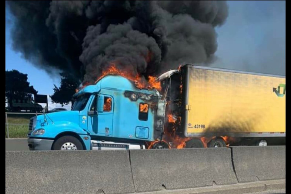 A semi-truck caught on fire right outside the George Massey Tunnel in the northbound lane on June 7. Photo: Jason Davidson
