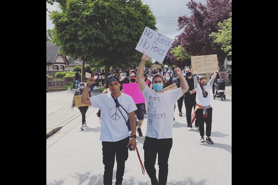 Declan Rodriguez (left) and his friend Dexter Allen lead the four-kilometre walk for George Floyd in Richmond on June 6. Photo submitted