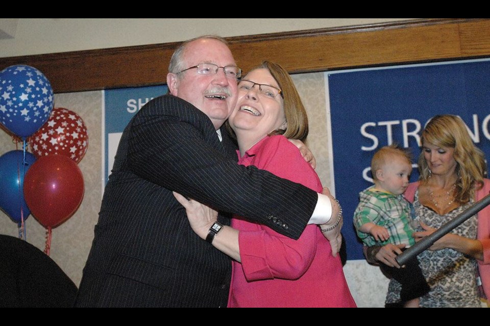 Prince George-Valemount MLA Shirley Bond hugs her husband Bill while celebrating her election on May 14, 2013 at the Liberal campaign party at the Coast Inn of the North. Bill died of a stroke in June, having been married to Shirley for 41 years. On Saturday she declared she will be running in the next provincial election, expected to be called this week by the governing NDP.