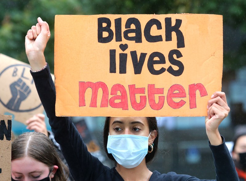 MARIO BARTEL/THE TRI-CITY NEWS A group of about 20 high school students protesting racism rally in