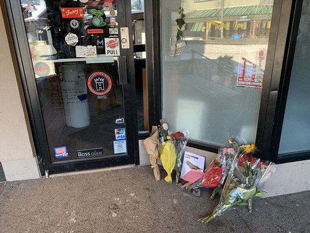 Flowers left at the shop Koehler owns, 2 Guys with Pipes, following his March 8 death.
