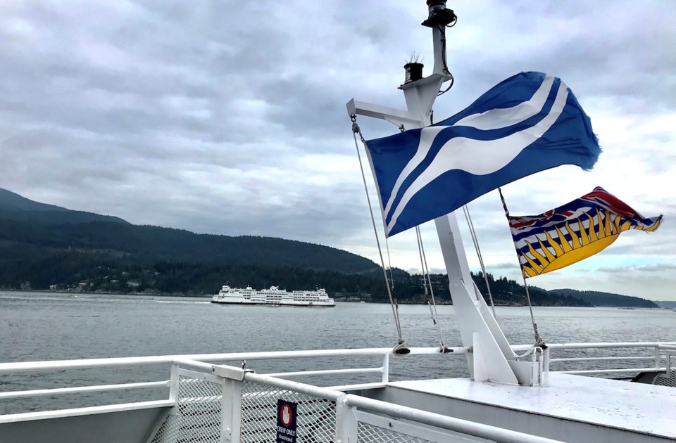 BC Ferries and BC flags flapping in the wind