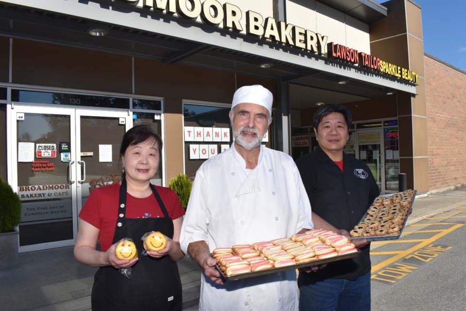 Current Broadmoor Bakery owner Tom Hsu (right), with his wife Catherine Liu (left) and former owner Gerben Beeksma. The store will close at the end of the month. Maria Rantanen photo