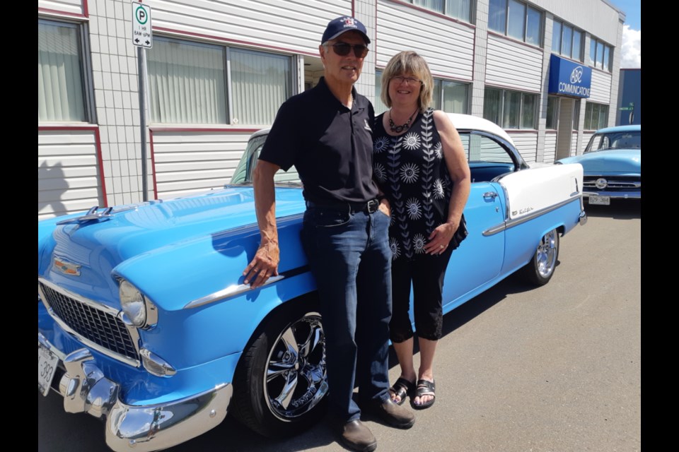Bob LeDuke and his wife Tammy pose with the 1955 Chevy Bel Air two-door hardtop sport coupe they bought this year to replace their Bel Air sedan that was totaled last summer when a truck backed into it.