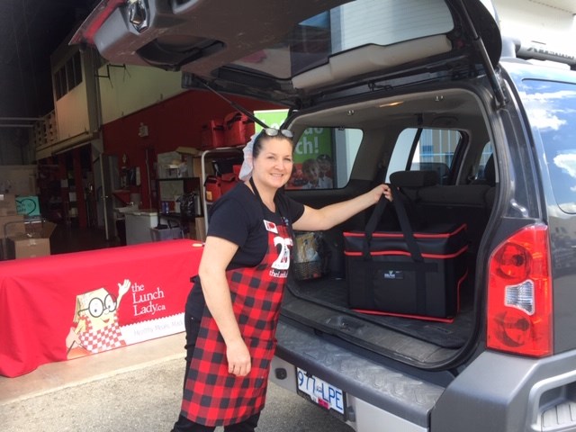 Grace Schmidt, The Lunch Lady, packs meals into her van