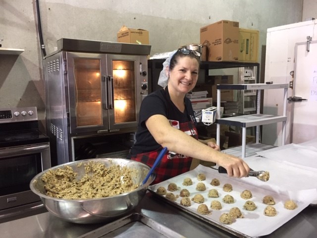 Grace Schmidt, owner of The Lunch Lady in Port Coquitlam, makes chocolate chip cookies for delivery to families needing a hot meal over the summer.