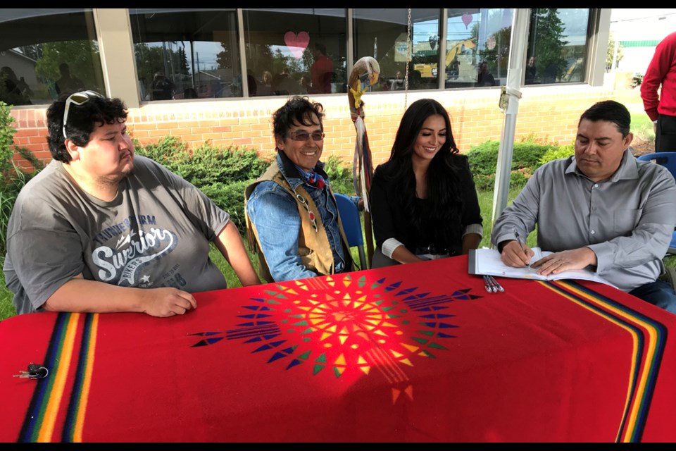 Doig River Chief Trevor Makadahay with councillors Brittany Brinkworth, Garry Oker, and Junior Davis sign a local education agreement with School District 60, June 22, 2020.