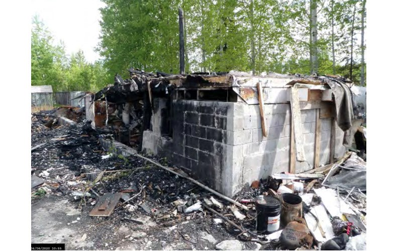 The burnt-out ruins of a house are seen at 5960 Buckhorn Lake Road on June 4, in this photo taken by Regional District of Fraser-Fort George bylaw enforcement officers.
