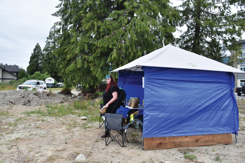 Hawkfeather Peterson stands outside a makeshift safe consumption site. It’s situated on private property across the road from the Hightide Supportive Housing complex run by RainCity Housing.