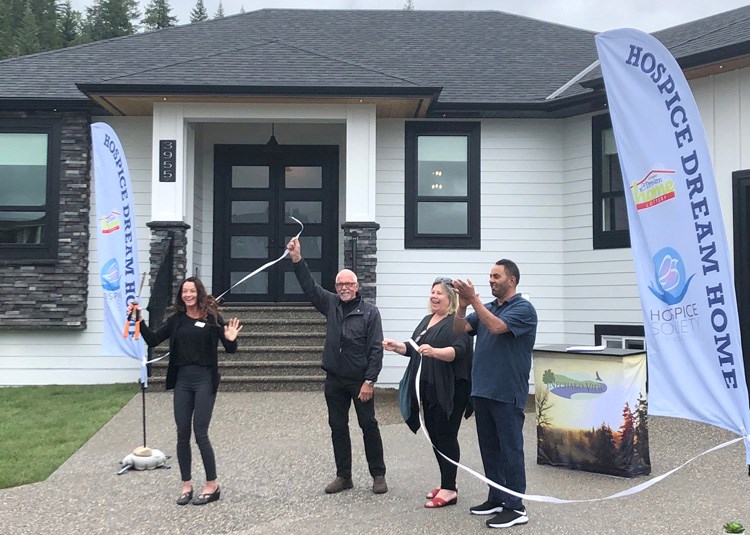 Sandra Klimm of the Prince George Hospice Society, John Brink of Brink Properties Ltd., hospice executive director Donna Flood and Ruby Grewel of North Nechako Homes cut the ribbon to officially open the 2020 Hospice Dream Home on Tuesday.