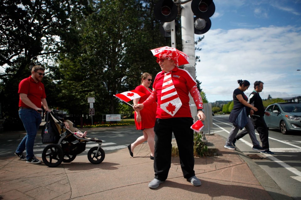 Vince Lamb shares some Canada Day spirit with passersby at the corner of Goldstream Avenue and Veteran&Otilde;s Memorial Parkway in Langford on Wednesday. Lamb spent 27 years in the Royal Canadian Air Force before moving to Victoria, and &Ograve;I'm just out to make people happy and help alleviate the stress due to COVID-19,&Oacute; he said. Canada Day