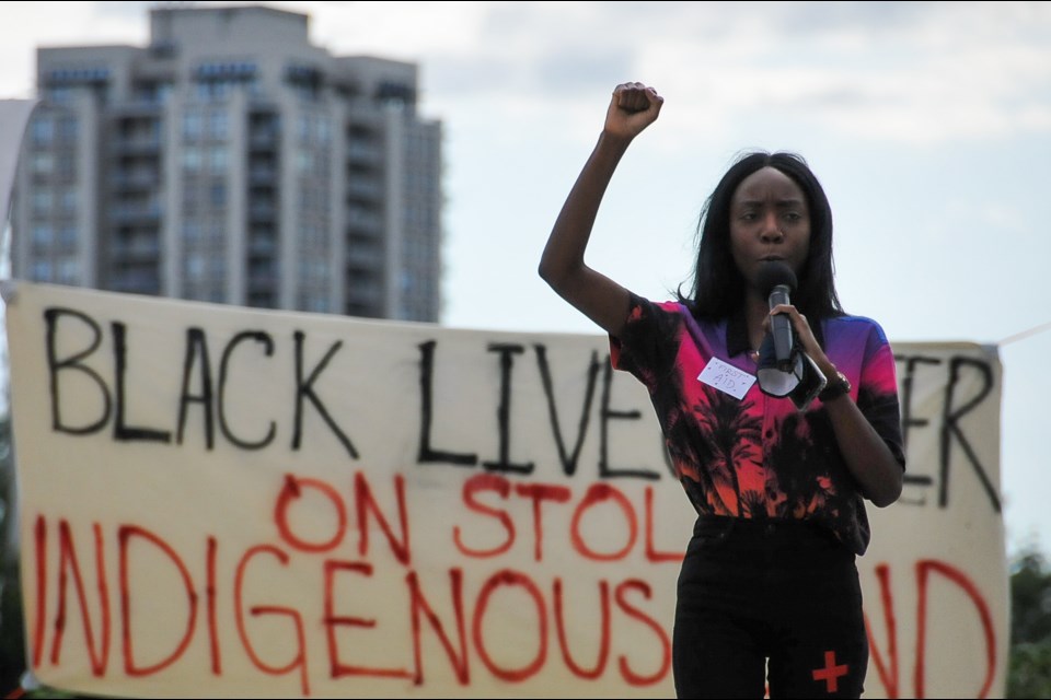 “This fist that you’ve been seeing, this is a sign of solidarity. This means to rise up, to defend. Not that we want to harm white people, that we want to eradicate people. We want to be able to exist in the same way white people can too," said Emma Kiwanuaa at a Black Lives Matter in Coquitlam July 4, 2020.