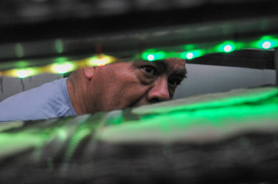 Carlos Hernandez of Santa Rosa Fábrica de Tortillas inspects the production line at his Port Coquitl