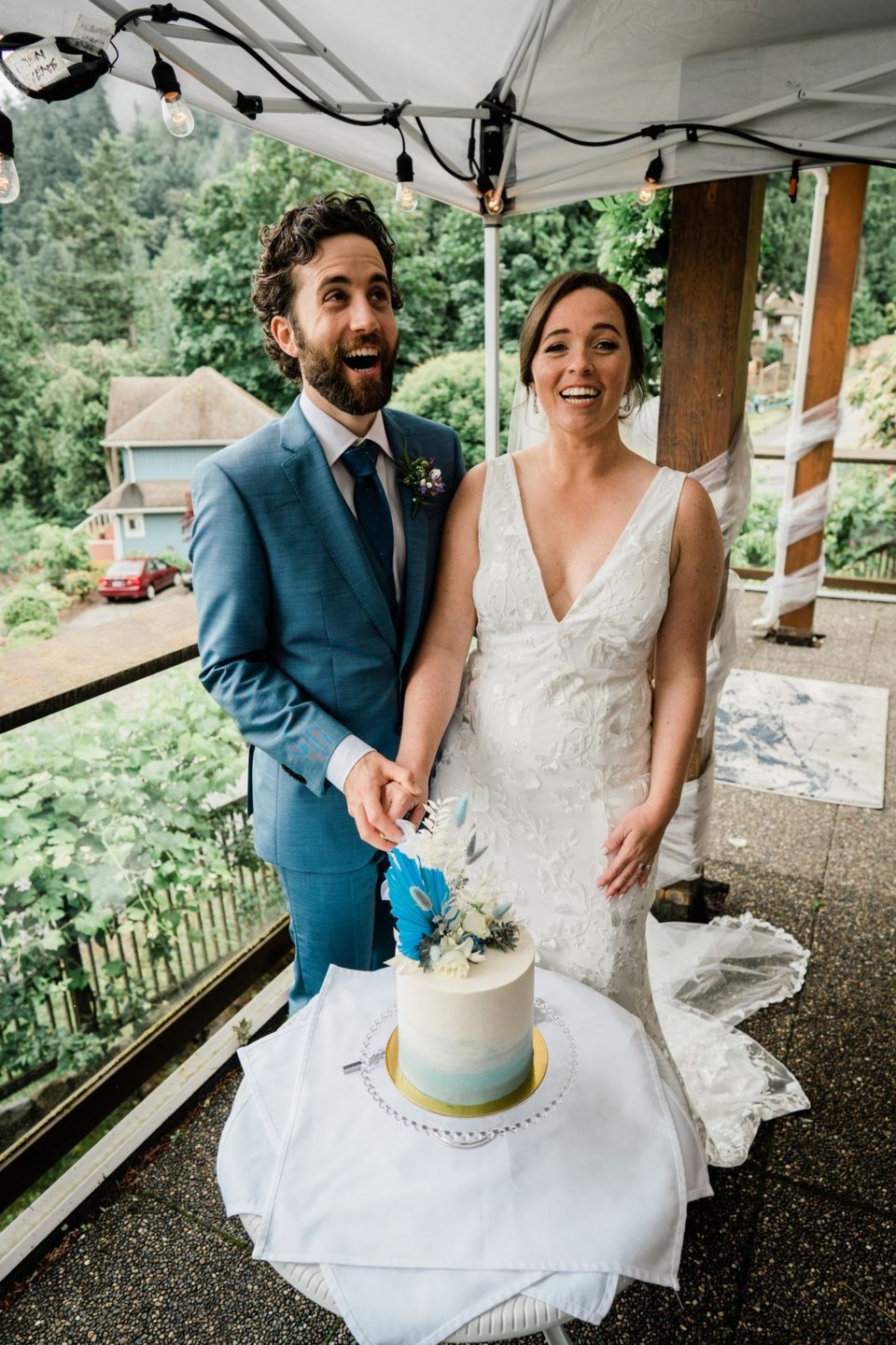 A couple cutting a wedding cake