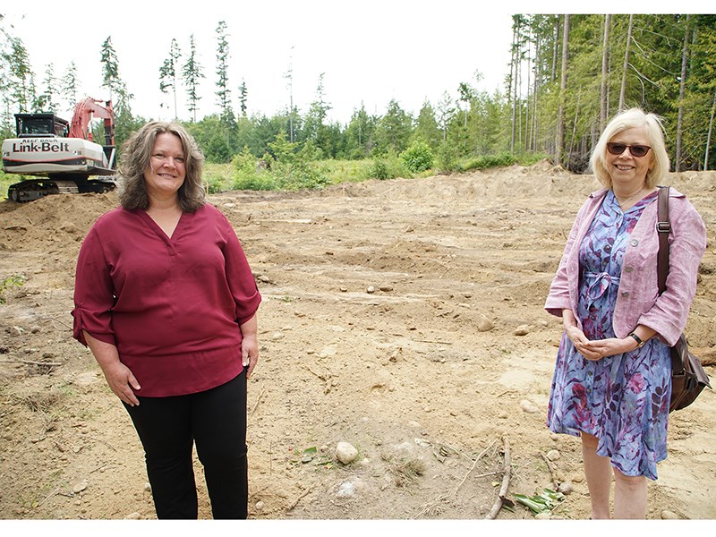 NEW HOUSING: Clearing work has begun at inclusion Powell River’s Artaban Street property, and Corinna Curtis [left], the organization’s director of adult services, and Lilla Tipton, chief executive officer, recently surveyed the proposed group home site at the Artaban Street location. Paul Galinski photo