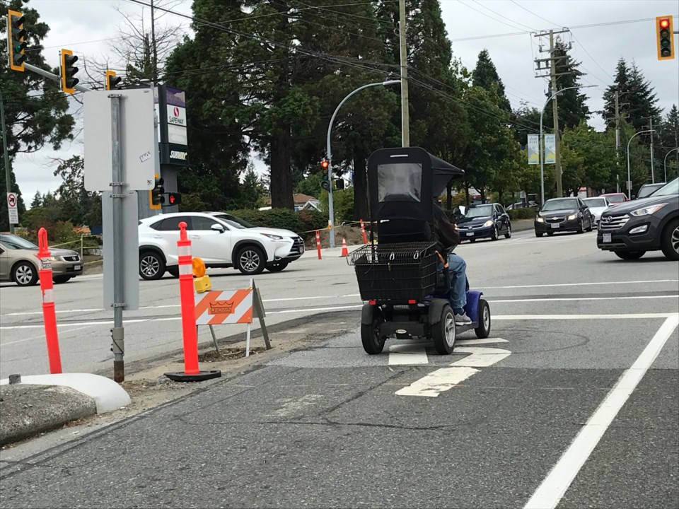 elderly man in scooter in delta