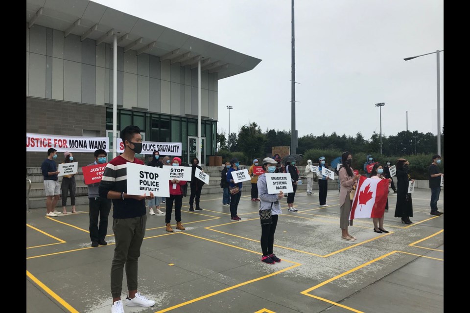 Richmond residents held another rally Saturday to show support for Mona Wang, a B.C. nursing student who was dragged and stepped on by an RCMP officer during a mental awareness check, and to protest police brutality. Photograph By Nono Shen