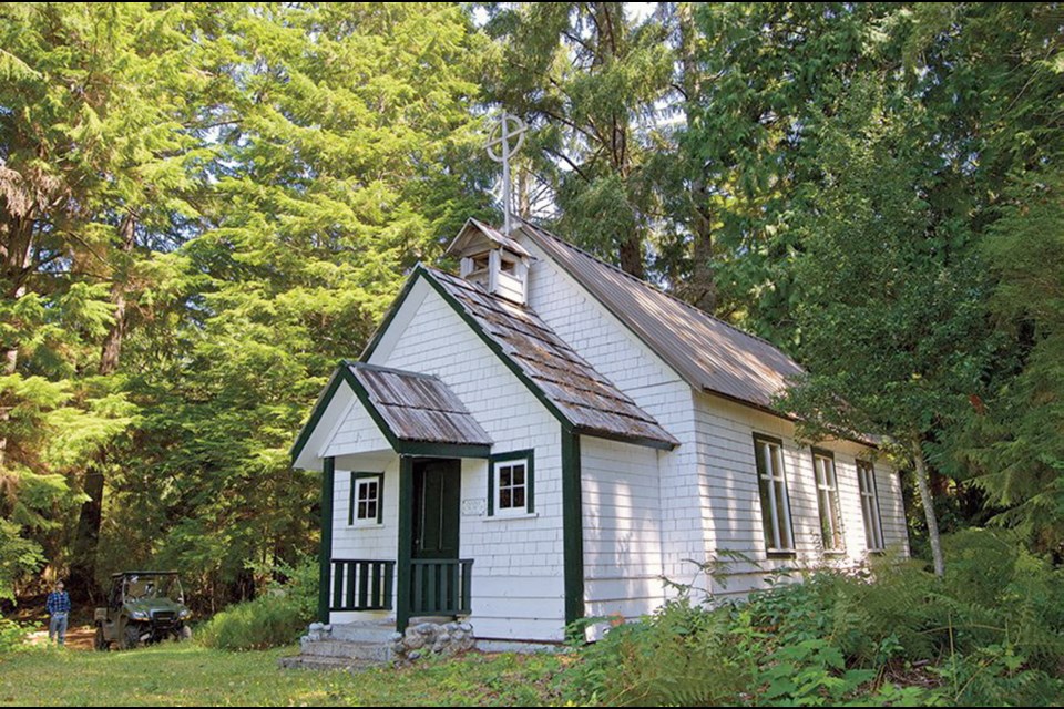 The tiny log church of St. Olaf's sits in the forest above Bergh Cove.