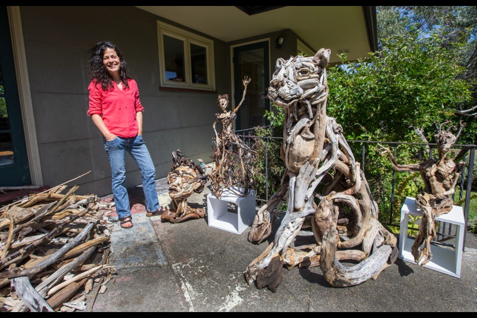 Driftwood artist Tanya Bub with a few of her creations.