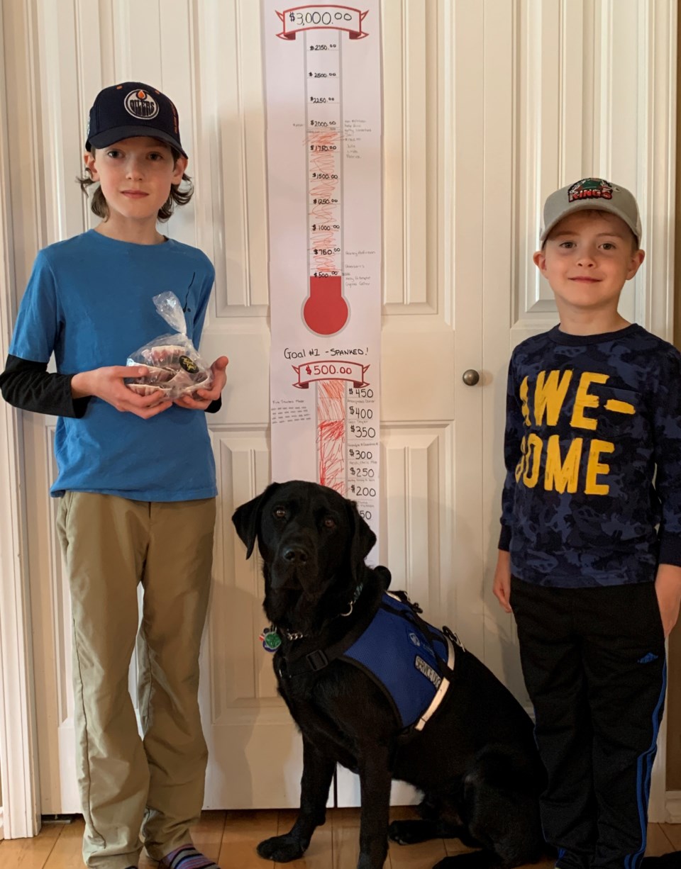 Autism service dog Kyle and Jakob Garfield with Rufus