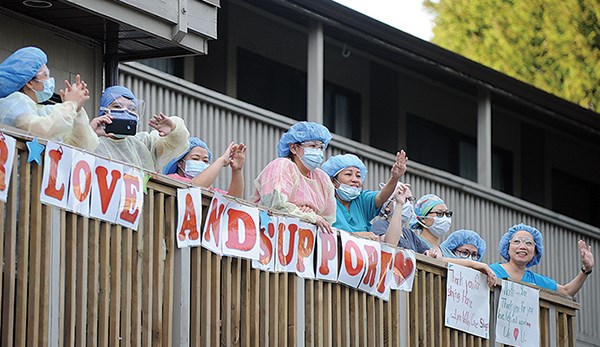 Lynn Valley Care Centre staff thank the community members who showed up to cheer them on during a nightly 7 p.m. health-care workers’ salute in April. The centre suffered 20 COVID-19 deaths despite a record of few past problems