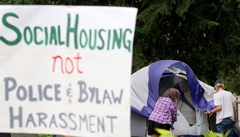 Homeless and homelessness advocates begin erecting an encampment next to the 3030 Gordon shelter in