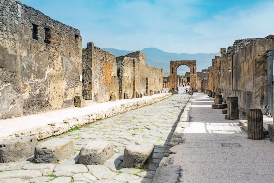 Via dell&rsquo;Abbondanza, the main street of ancient Pompeii, Italy, was buried by volcanic ash for centuries.