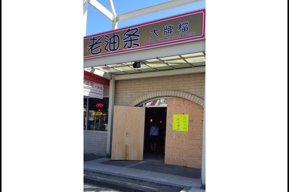Double Double Restaurant's glass windows have now been boarded up. Photo: Double Double Restaurant/Facebook