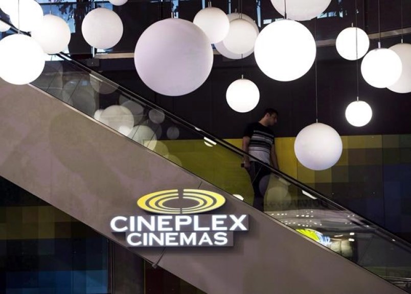 A man makes his way down an escalator during the Cineplex Entertainment company's annual general mee