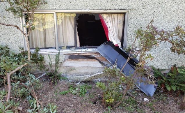 Burnaby RCMP posted photos of the runaway truck and two damaged houses. Burnaby RCMP