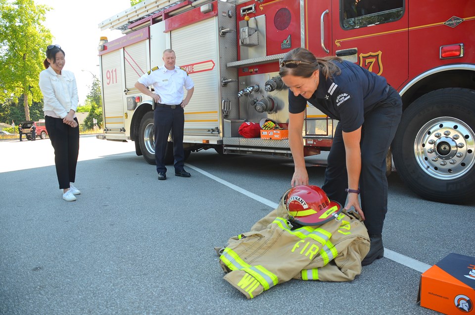 Camp Ignite, camper Irene Chang, fire Chief Chris Bowcock, Lt. Heather Wilson