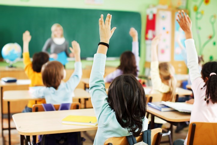 Kids in an elementary school classroom.