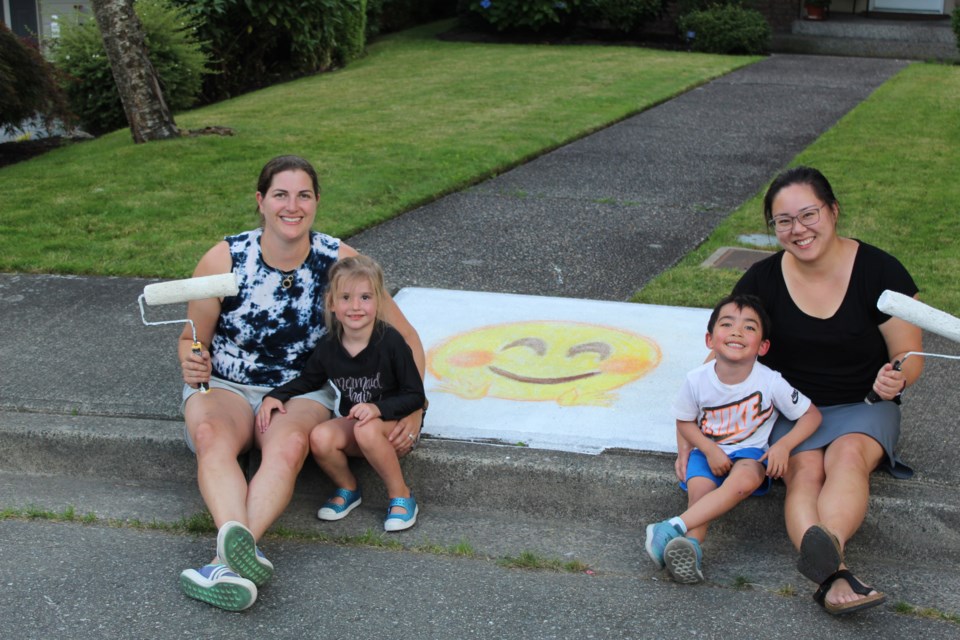 Kwantlen Court residents joined forces to turn their cul-de-sac into a community sidewalk art gallery, thanks to a neighbourhood grant.