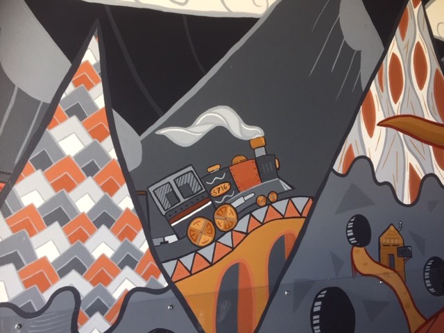 The first train through Port Coquitlam is captured in a mural by Taylor Klassen.