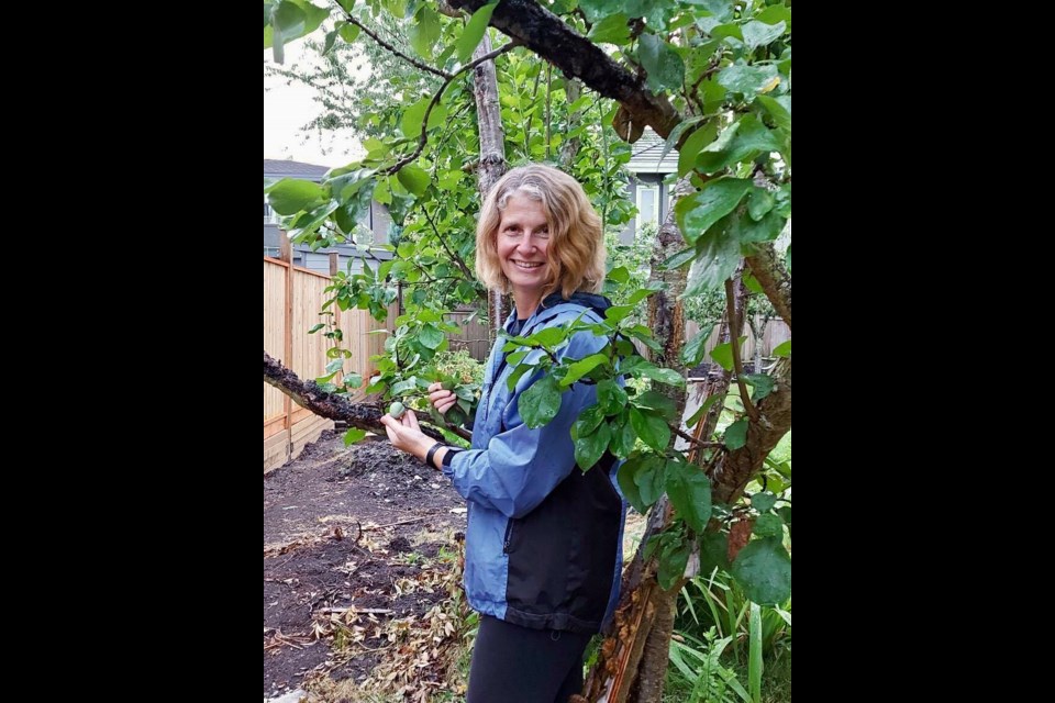 Richmondite Gail Townsley and her ten-year-old plum tree. Photo submitted.