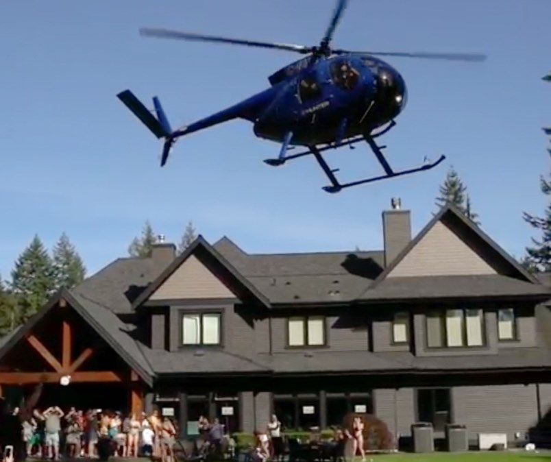 A helicopter lands at a party in Anmore on June, 1, 2019.