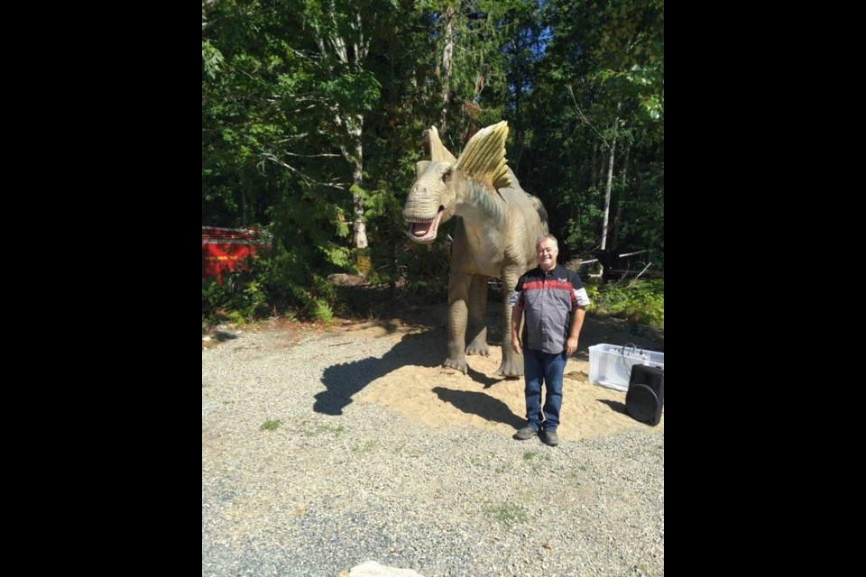 Stan Pottie with Lance, a 4.5-metre-high animatronic amargasaurus, in Lantzville, just north of Nanaimo. COURTESY OF STAN POTTIE