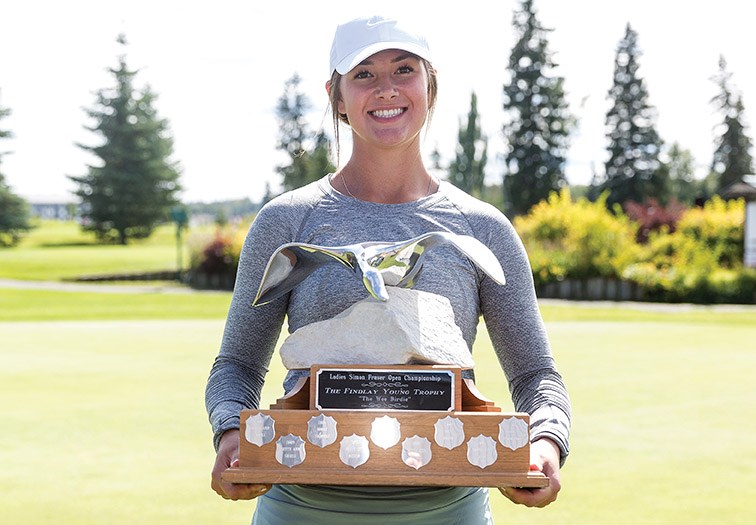 Citizen Photo by James Doyle. Natasha Kozlowski poses for a photo with the Findlay Young Trophy on Sunday afternoon at Prince George Golf and Curling Club after claiming her third straight Ladies Simon Fraser Open Championship. Kozlowski finished the weekend with scores of 78 on Saturday, and a 74 on Sunday, which including a scorching 32 on front nine. Lisa Kerley finished second with scores of 82 on Saturday and 73 on Sunday.