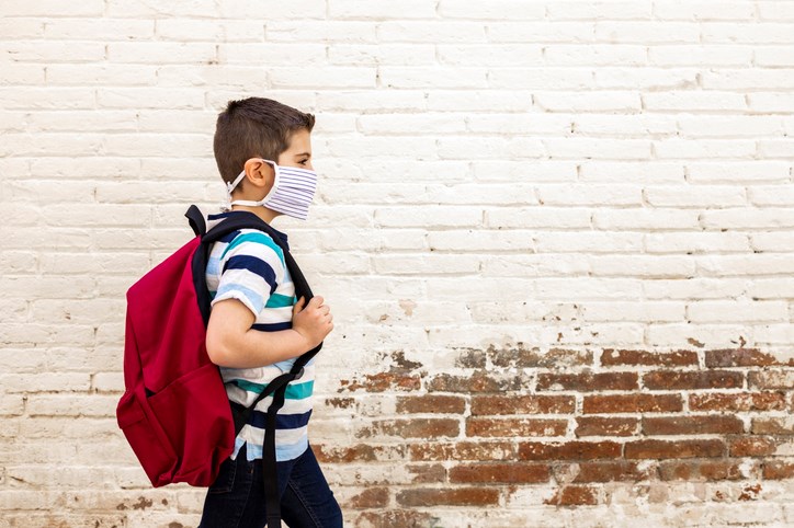 A child heads to school during the COVID-19 pandemic