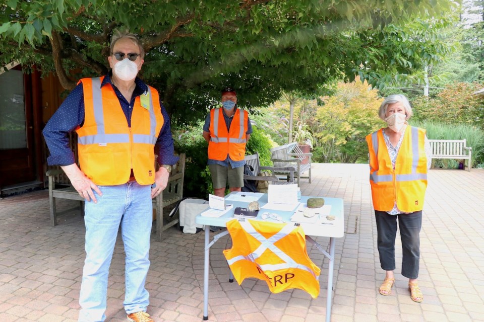 Don Youngson, Edward Wachtman and Karen Wristen at the NERP table Aug. 18.