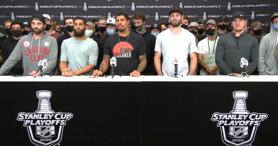 Nazem Kadri, Pierre-Edouard Bellemare, Ryan Reaves, Jason Dickinson, and Bo Horvat stand with other