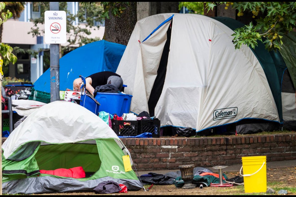 Campers pack up at Centennial Square on Monday. DARREN STONE, TIMES COLONIST     Aug. 31, 2020